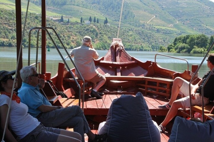 a group of people sitting on a boat
