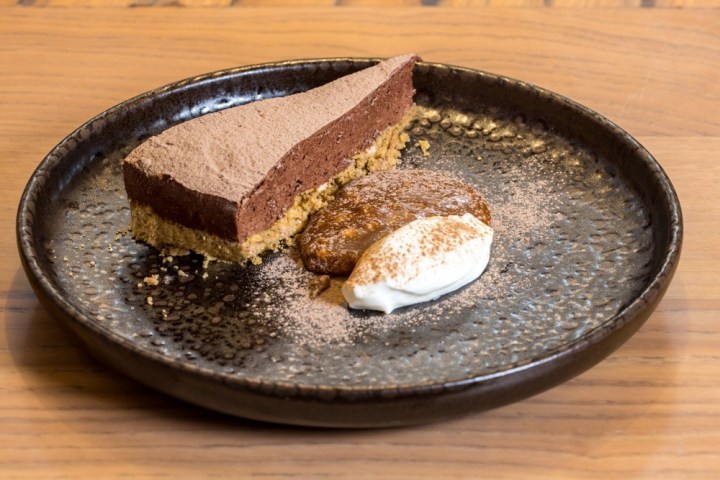 a piece of cake sitting on top of a wooden table