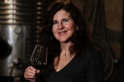 a person holding a wine glass