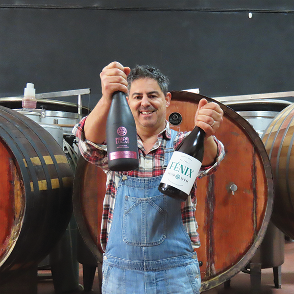 a person standing in front of a barrel