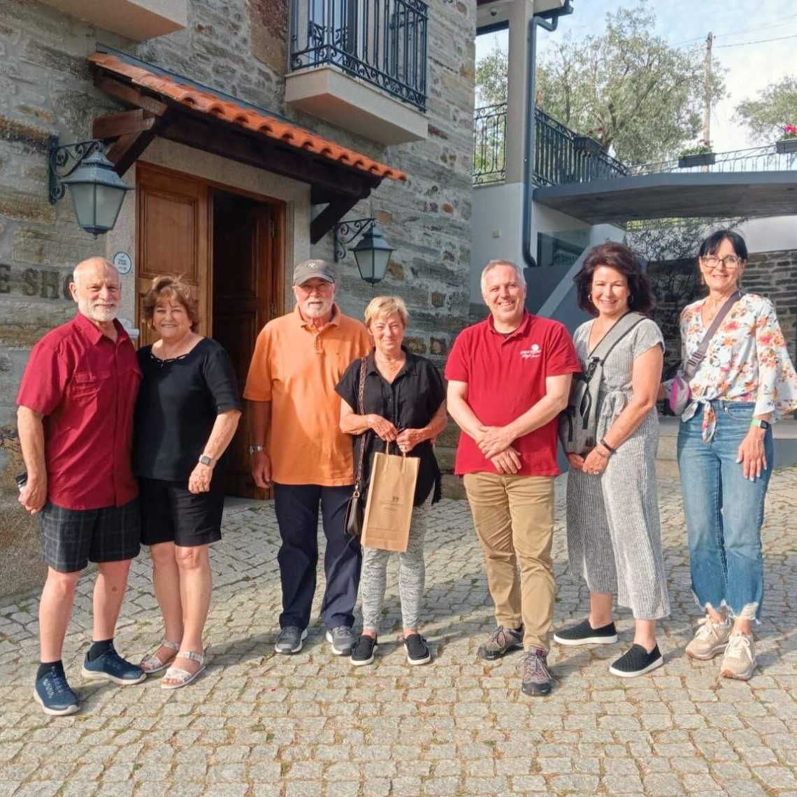 a group of people standing in front of a building